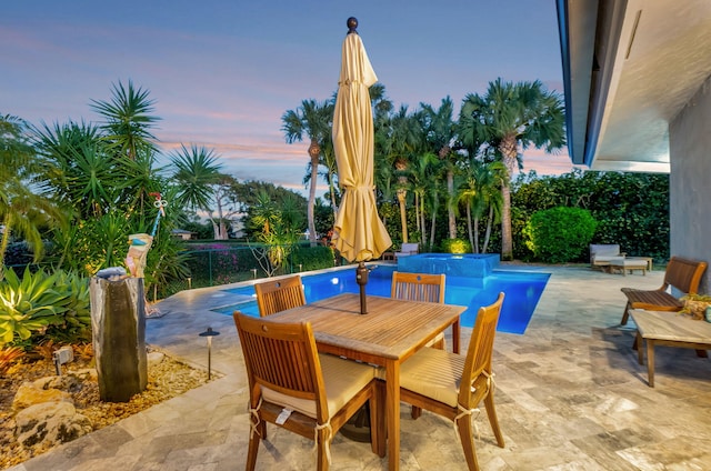 view of patio terrace at dusk