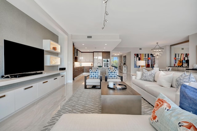 living room with a notable chandelier