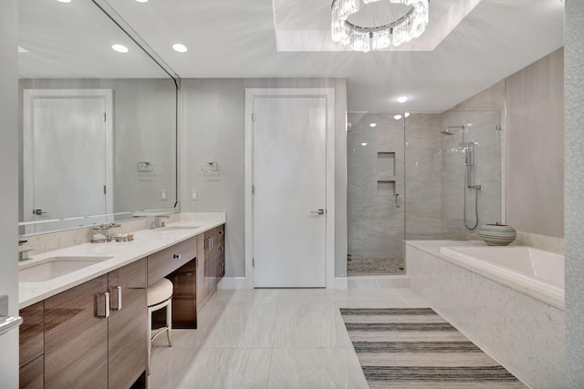 bathroom featuring vanity and independent shower and bath