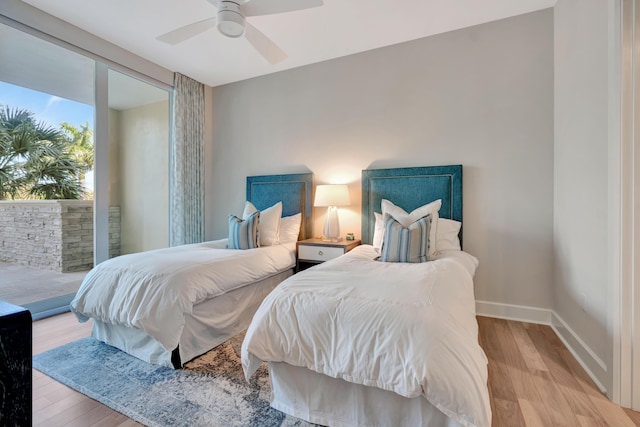 bedroom featuring ceiling fan and light hardwood / wood-style flooring