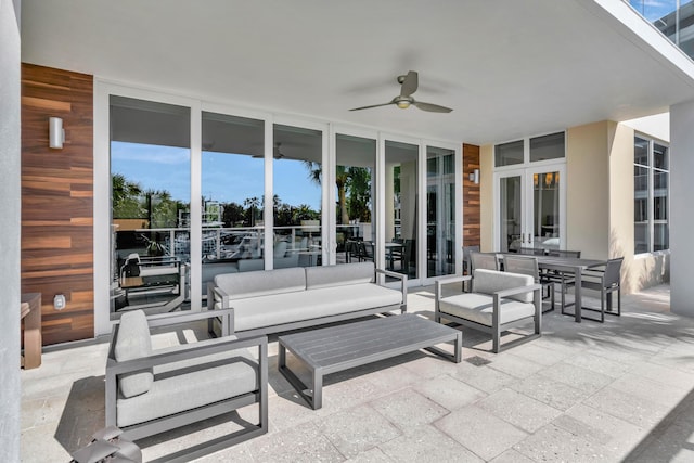 view of patio with ceiling fan and an outdoor living space