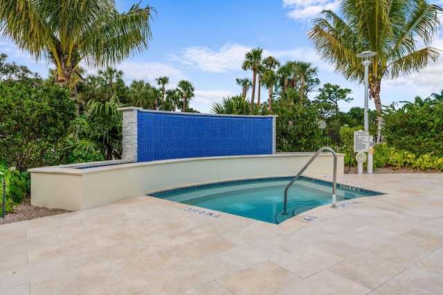 view of pool with a community hot tub