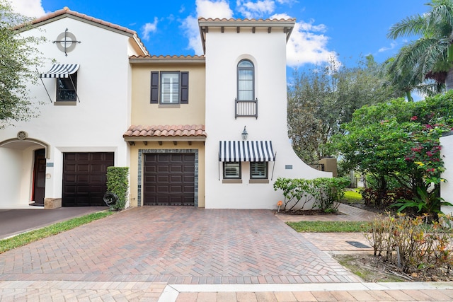 mediterranean / spanish-style home featuring a garage