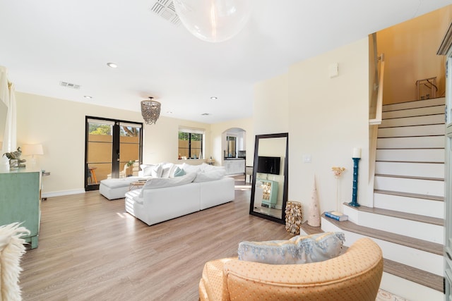 living room featuring light wood-type flooring and french doors