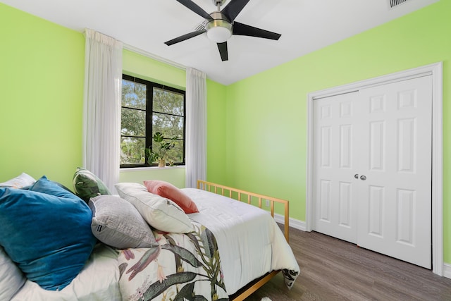 bedroom with ceiling fan and hardwood / wood-style floors