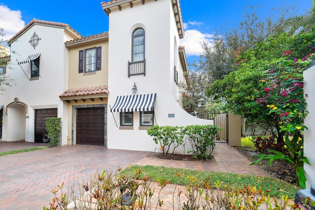 mediterranean / spanish house featuring a garage