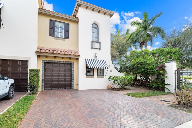 mediterranean / spanish-style house featuring a garage