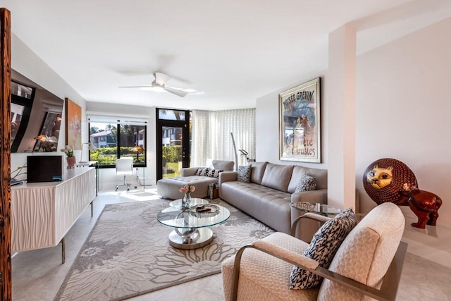 living room featuring ceiling fan and light tile patterned floors