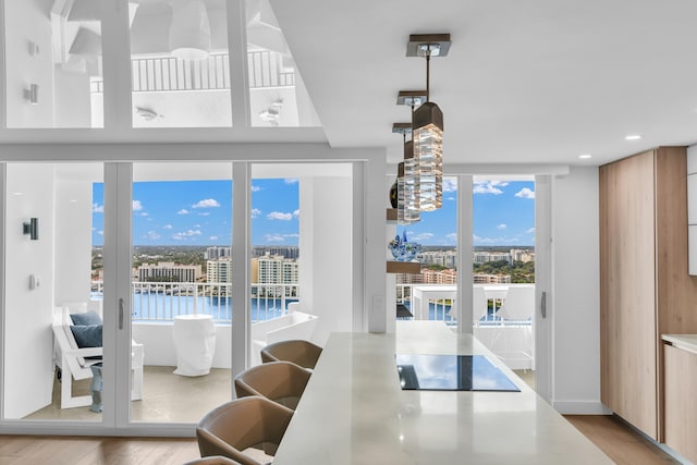 dining room with a wealth of natural light and a water view