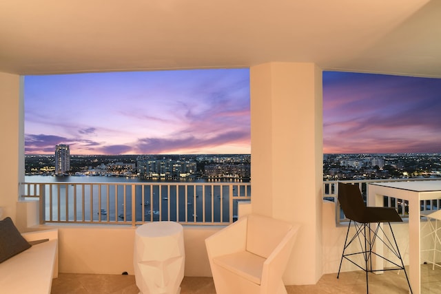 balcony at dusk with a water view