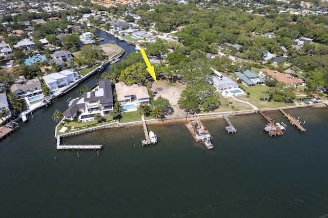 bird's eye view with a residential view and a water view