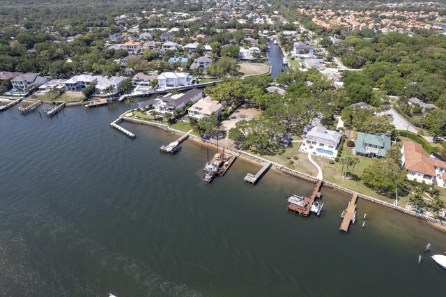 view of dock with a water view and a yard