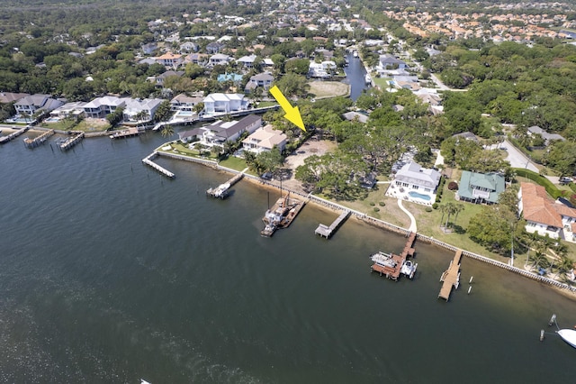 drone / aerial view featuring a residential view and a water view