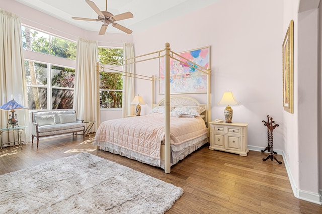 bedroom featuring hardwood / wood-style flooring and ceiling fan