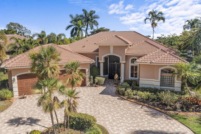 mediterranean / spanish-style house featuring a garage