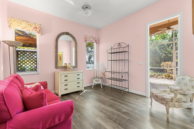 sitting room with hardwood / wood-style flooring, plenty of natural light, and ceiling fan