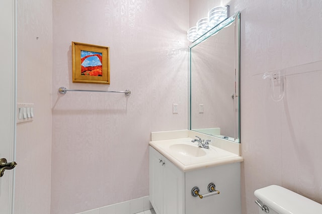 bathroom with vanity and toilet