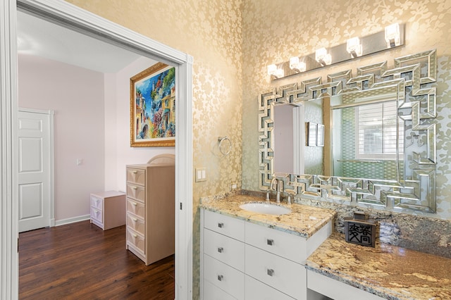 bathroom featuring vanity and hardwood / wood-style floors