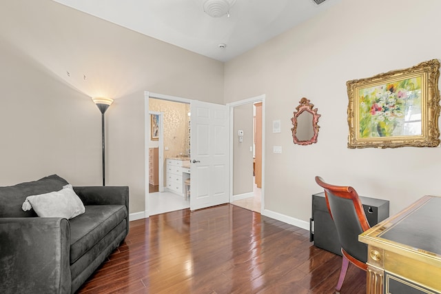 office with dark hardwood / wood-style floors