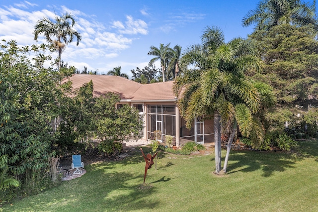 view of yard featuring a sunroom