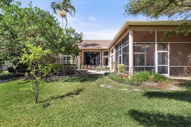 view of yard featuring a sunroom