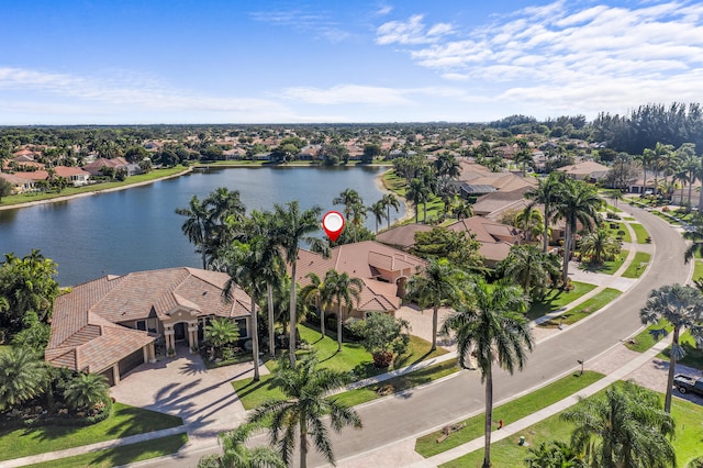 birds eye view of property with a water view