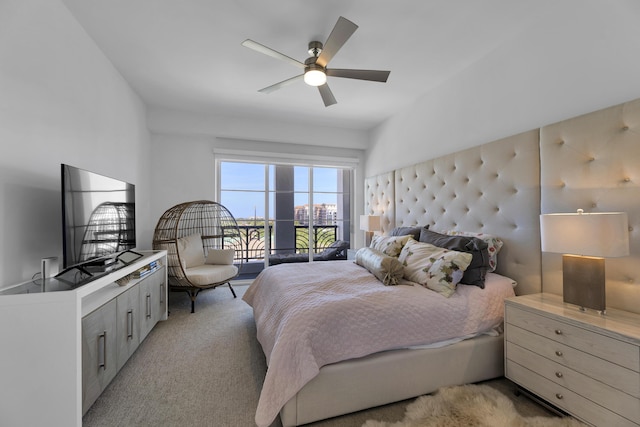 bedroom featuring ceiling fan, light colored carpet, and access to outside