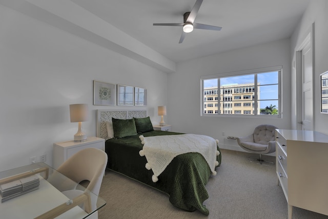 bedroom with ceiling fan and light colored carpet