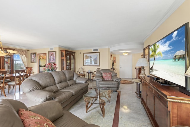 living room featuring ornamental molding and a notable chandelier