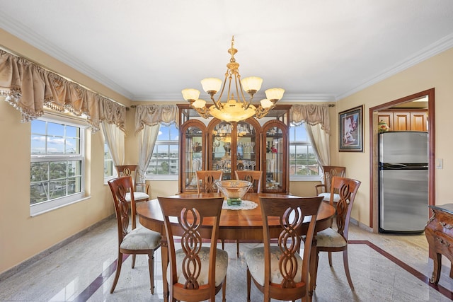 dining room with crown molding, plenty of natural light, and a notable chandelier