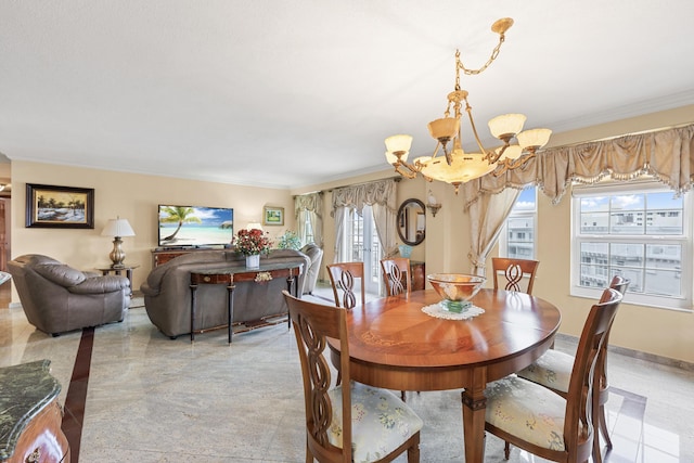 dining room featuring an inviting chandelier and ornamental molding