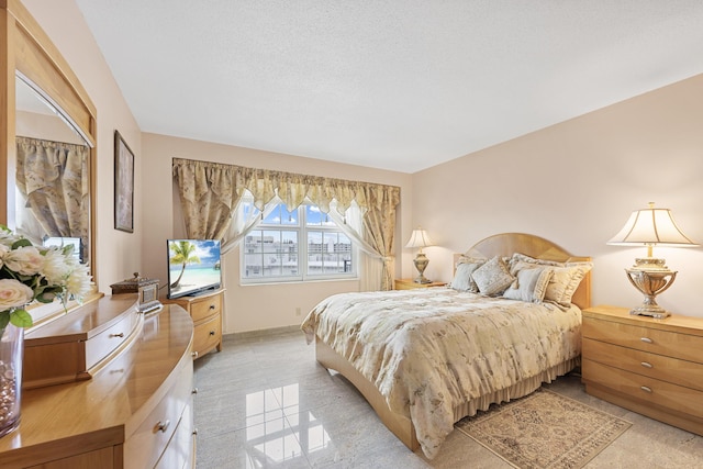 bedroom featuring a textured ceiling