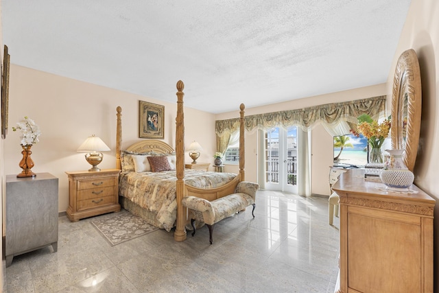 bedroom with access to exterior, french doors, and a textured ceiling