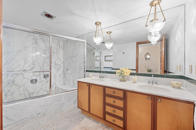 bathroom with enclosed tub / shower combo and vanity