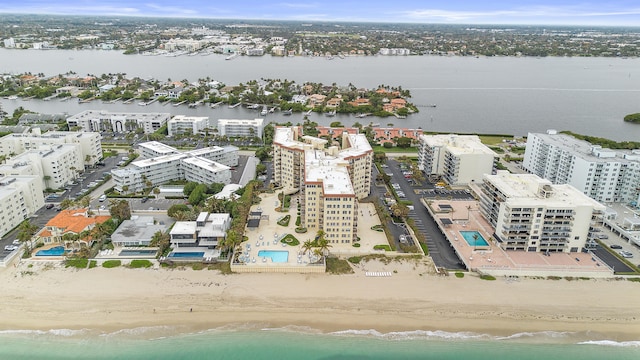 bird's eye view with a view of the beach and a water view