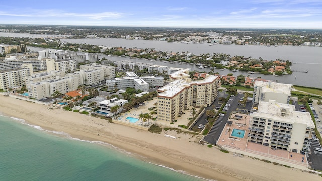 birds eye view of property featuring a water view and a view of the beach