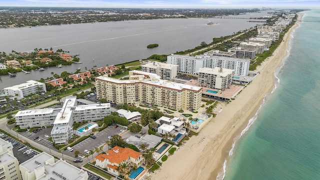 aerial view with a view of the beach and a water view