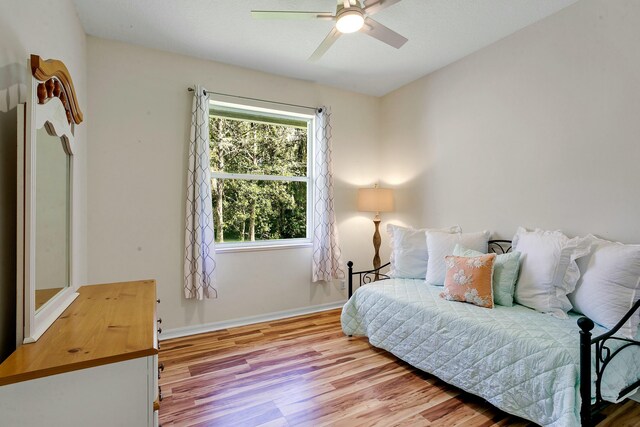 bedroom featuring ceiling fan and light wood-type flooring