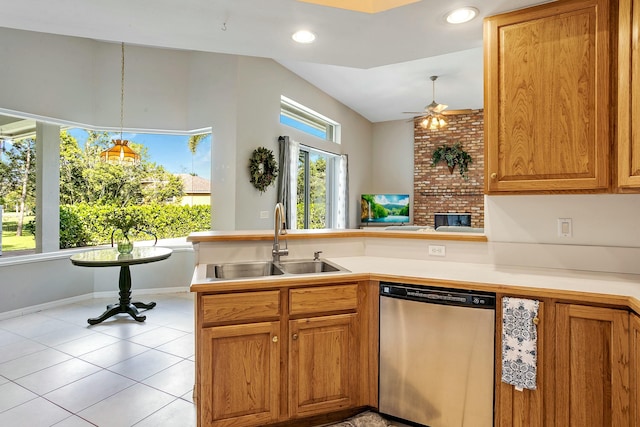 kitchen with ceiling fan, dishwasher, sink, kitchen peninsula, and plenty of natural light