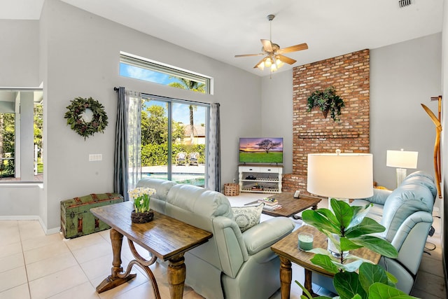 living room with ceiling fan and light tile patterned floors