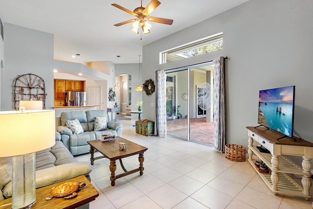 tiled living room featuring ceiling fan