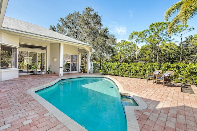 view of pool featuring a patio