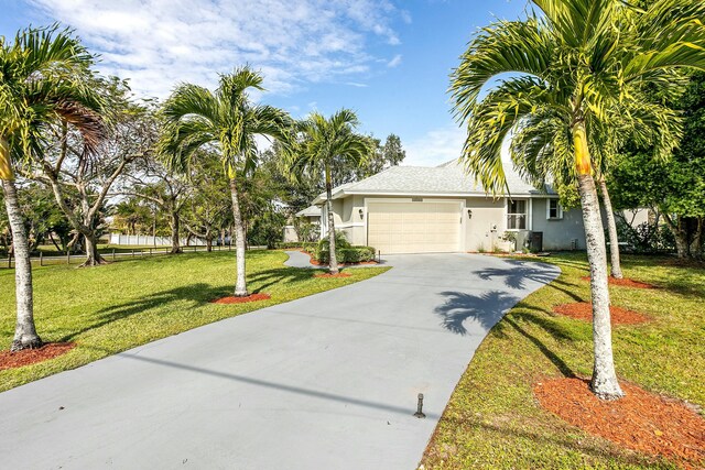 view of front facade featuring a garage and a front lawn