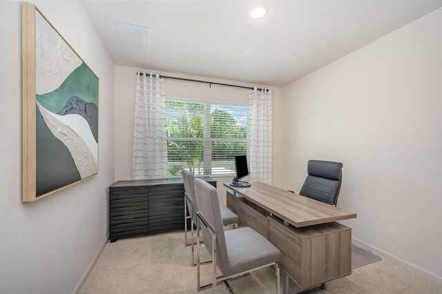 bedroom featuring light carpet