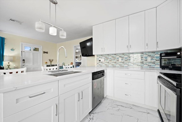 kitchen featuring visible vents, a sink, decorative backsplash, stainless steel appliances, and marble finish floor