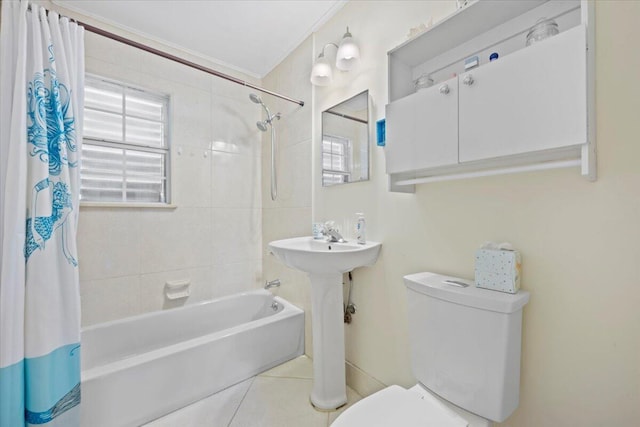 bathroom with tile patterned flooring, toilet, and shower / tub combo