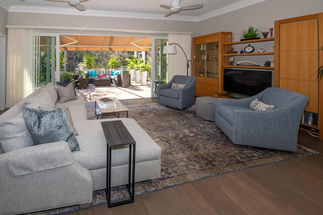 living room with ceiling fan, wood-type flooring, and crown molding