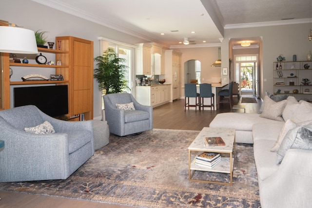 living room with ornamental molding and dark hardwood / wood-style floors