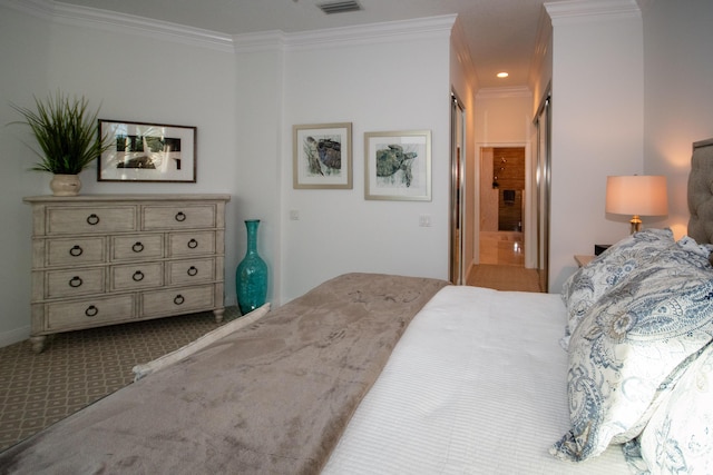 bedroom featuring carpet floors and crown molding