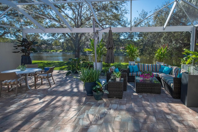 view of patio / terrace with an outdoor living space and a water view